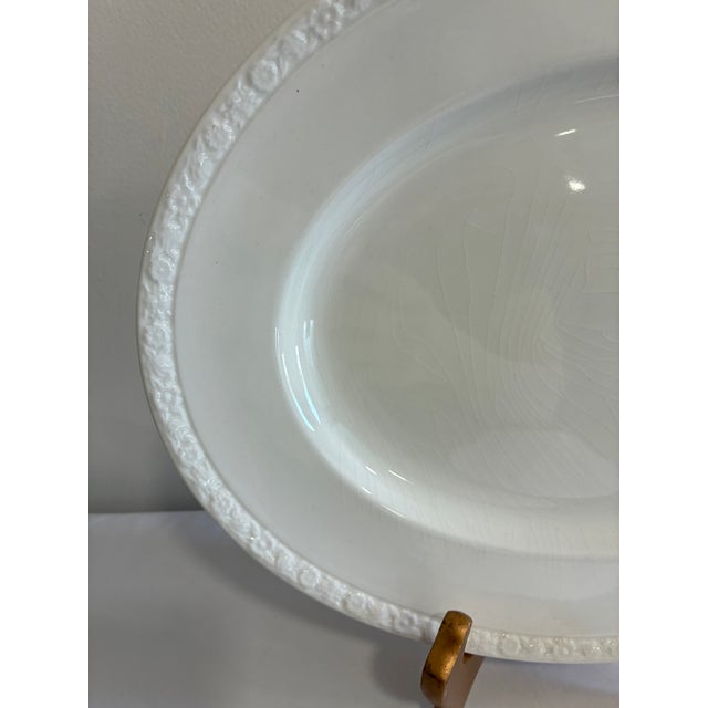 An oval ironstone platter from Wedgwood & Co. Ltd's Hedge Rose pattern, in all-white glaze with a delicately embossed...