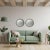 An exquisite pair of Art Deco-style round mirrors exuding timeless sophistication and featuring a harmonious blend of...