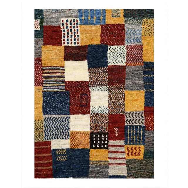 Gabbeh rugs are made by the nomadic Qashqai tribes of southern Iran. They are rough cut and long piled rugs of rich color...