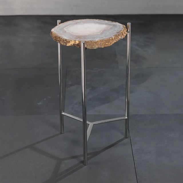 This awesome side table would look great in any room. The simple and sturdy steel base accentuates the beauty of this...