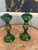 A striking and refined pair of vintage Bohemian glass candlesticks, rendered in a rich emerald green and exquisitely hand-...
