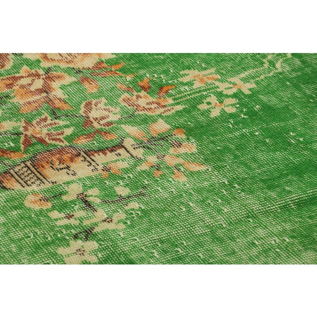 Hand-knotted in wool, originating from Turkey circa 1960-1970, a 5x9 mid-century Turkish interpretation of the 1920s Art...