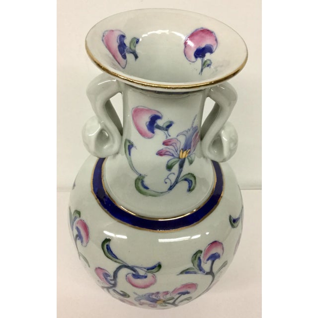 Lovely vase with gilt gold details. The Cobalt Blue is strikingly rich against the white background with rose flowers....