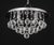Quoizel Chrome and Raindrop Crystal Chandelier, with four light sockets, circular chrome base, and hanging faceted crystal...