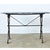 An exceptional 19th century rectangular French bistro table with fabulous design elements throughout. The marble slab has...