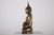 A carved wooden buddhist figure from the shan state, lacquered and gilded. The strongly modeled face and richly worked...
