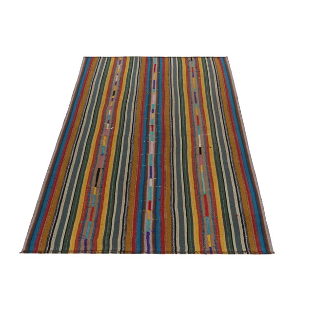 Handwoven in Turkey circa 1950-1960, this 6x9 vintage Chaput style Kilim rug enjoys a one of a kind approach in weaving....