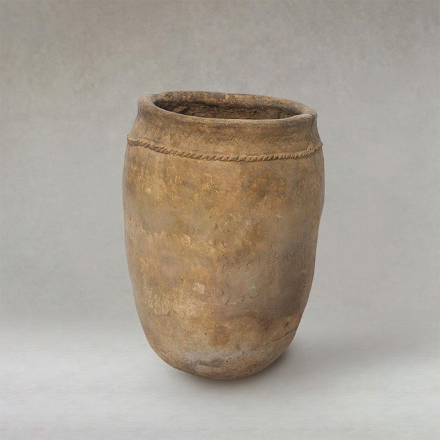Antique Berber unglazed clay storage pot from Morocco, dating from the early 20th century, with a softly rounded form and...