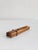 A wonderful nutcracker shaped like a clothespin. The wood is likely walnut. The hardware is made of brass.
