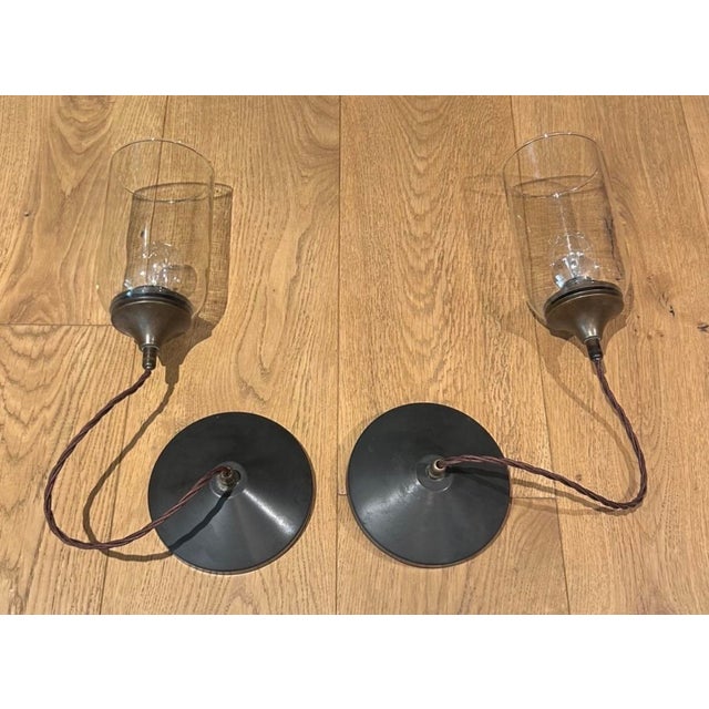 Two glass and oil-rubbed bronze small hanging pendant lights. Purchased at Obsolete Los Angeles.