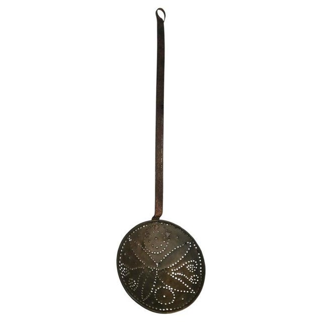 19thc Cast iron and brass skimmer or chest nut roaster. This metal item can with stand extreme heats and is a great piece...