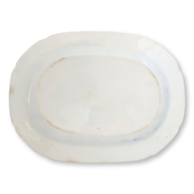 An antique English blue and white transferware platter in the Rogers Elephant pattern, produced in Staffordshire circa the...