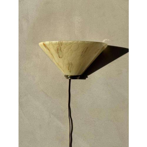 Mid-century wall lamp from the 1970s, crafted in marbled glass with brass details. The shade retains the same calm, open...