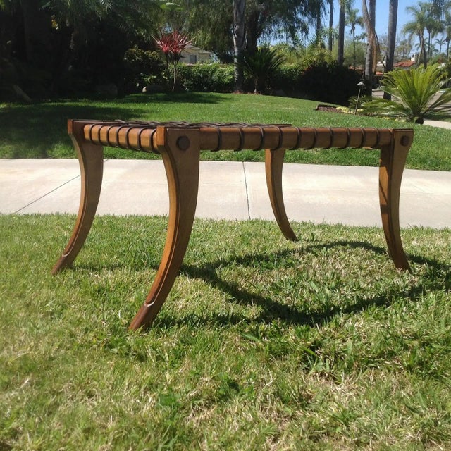 Mid century style Klismos bench. The bench is in excellent condition . The wood is stained walnut and has a leather...