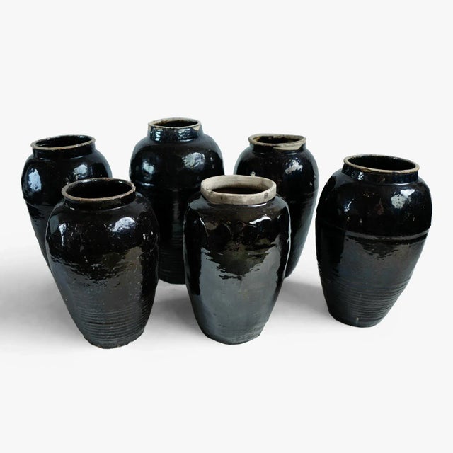 Vintage black ceramic village vase. Hand crafted pieces vary with rustic finish and beautiful patina. Each unique and...