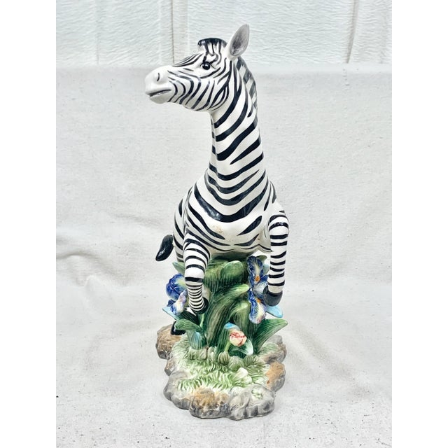 Stunning large vintage zebra figurine. Ceramic. Unsigned but similar to Staffordshire. Features a large zebra on top of...