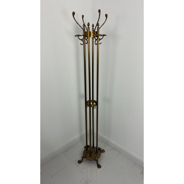 Italian brass coat rack in the Hollywood Regency style, 1940s Good condition, with minor signs of wear. Height 171 cm,...
