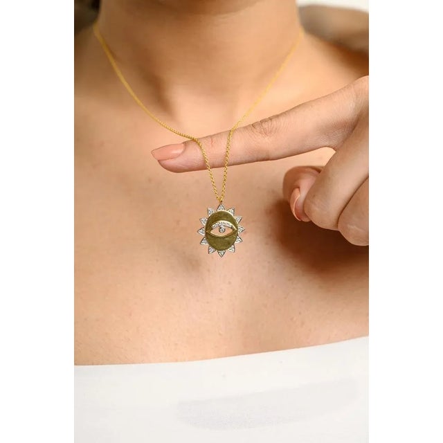 This is part of Chairish’s Fine Jewelry assortment. Evil Eye Medallion Diamond Necklace in 18K Gold studded with round cut...