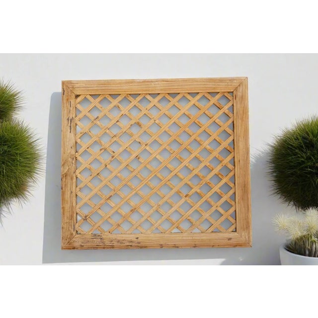 A traditional architectural feature of Chinese buildings, this beautiful antique Chinese lattice window was prominent in...