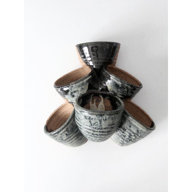 This is a vintage studio pottery tiered planter vase. The handcrafted planter features six tiered connected pots with a...