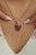 This whimsical strawberry pendant features 2.55 carats of rubies set in 14K yellow gold. Each ruby measuring approximately...