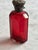 19th-century Victorian cranberry cut glass perfume bottle with an ornate repoussé sterling silver hinged cap. Includes...