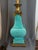 Mid-century Stiffel Hollywood Regency Style. Teal green glazed ceramic with brass trim. Milk glass like torchiere.