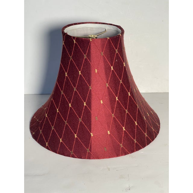 Burgundy red silk lamp shade embroidered in diamond pattern.