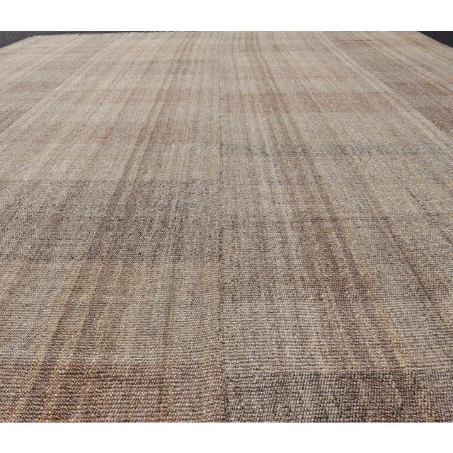 Measures: 10'4 x 14'4 Handwoven Textured Kilim Rug with Subtle Geometric Design 10'4 x 14'4. Keivan Woven Arts /...