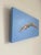 A graceful diver immediately brings feelings of weightlessness and ease to the viewer. Pointed fingers and toes imply a...