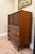 Authentic vintage Lane Furniture tall chest featuring sculpted walnut drawer fronts, fluted cabinet doors, tapered legs,...