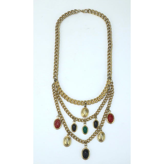 C.1980 scarab bib style necklace with gold tone chain link. The chain link necklace consists of three layers of double-...