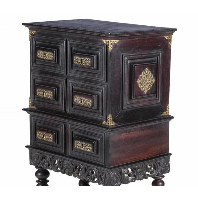 Portuguese 18th century cabinet Made of kingwood. Three drawers simulating four. Base with profusely decorated skirts with...