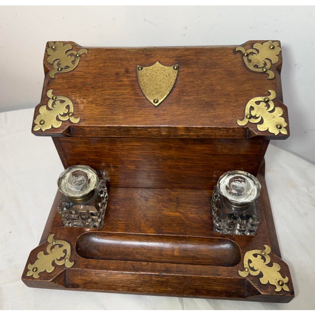 This antique 19th century English wood and bronze writing stand is a beautifully crafted piece that combines functionality...