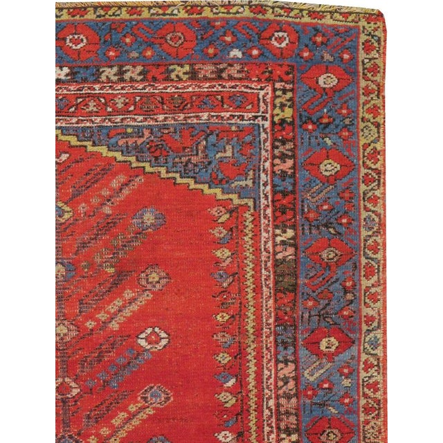 An antique Turkish Kula carpet from the turn of the 20th century with the "tree of life" motif. Measures: 3' 9" x 5' 5"