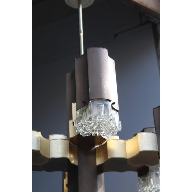 Golden and Brown Chandelier from Sciolari, 1970s, in Very Good conditions. Designed 1970 to 1979 This piece has an...