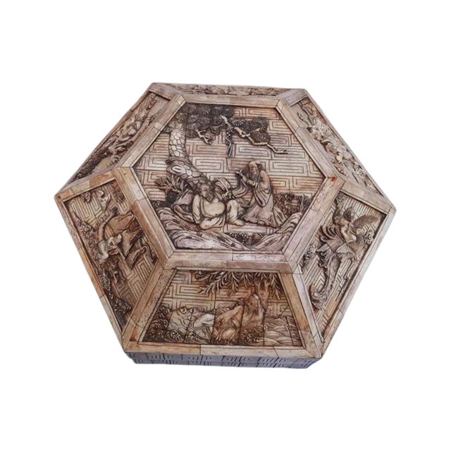 An exceptional large Chinese carved bone hexagonal jewelry casket featuring finely hand-carved panels depicting scholars,...