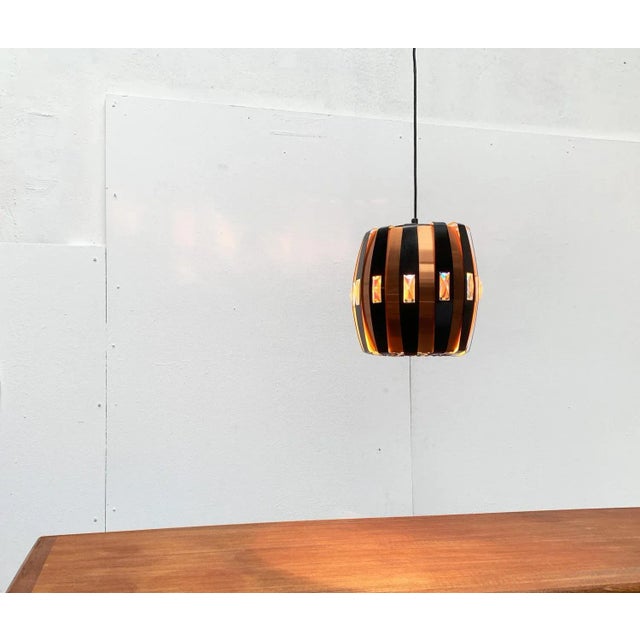 Danish mid-century pendulum by Coronell Elektro based on a design by Werner Schou from the 70s. An imposing and solemn...