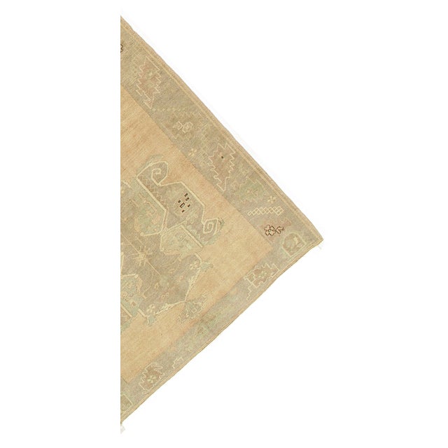 A vintage Turkish rug from the 1950s, handwoven with high-quality wool in a warm and inviting color palette.