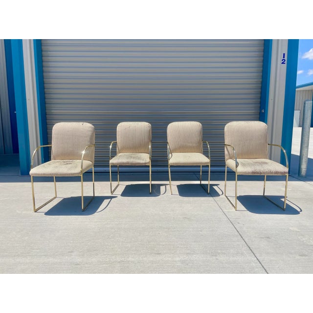 This glamorous set of four mid-century dining chairs by Design Institute of America (DIA) perfectly blends Hollywood...