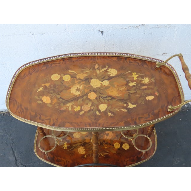 This vintage Bar Tea Cart is made of wood, solid wood, veneer, and metal. It was made in Italy, and it has a sticker. It...