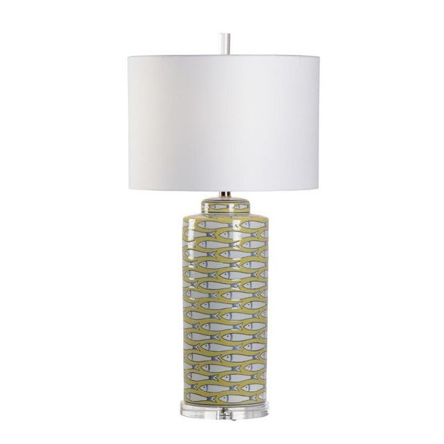 Add a touch of whimsy to your waterfront retreat with fish tail lamp. This 32" table lamp features a white fish design on...