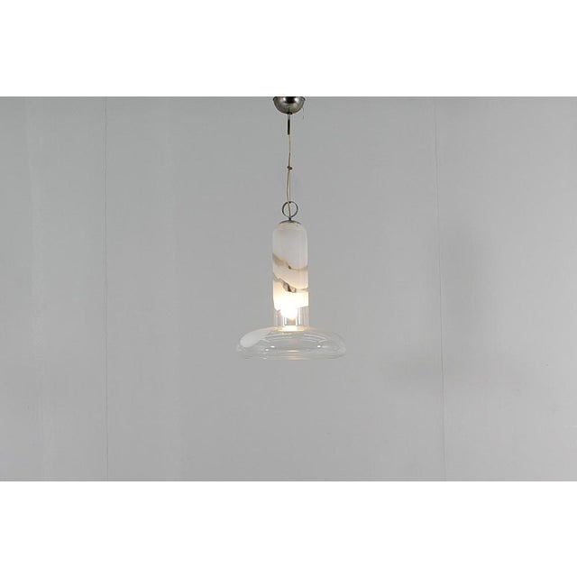 Stunning suspension lamp attributable to Carlo Nason for Mazzega, 1960s. Transparent Murano glass bell with irregular...
