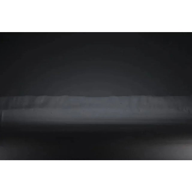 The pared down design of this remarkable coffee table is the essence of simplicity. Its industrial inspired lines are...