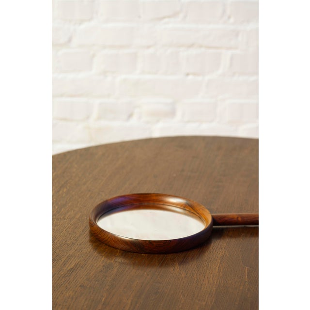 A rare hand mirror designed by Uno & Osten Kristiansson for Luxus, Sweden, 1950s. Elegantly made out of solid rosewood...