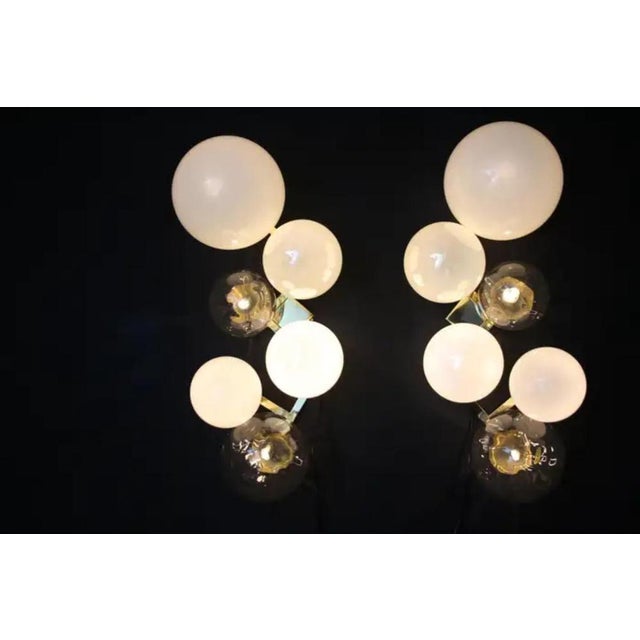 This magnificent pair of sconces is a real wall decor. It is made of a brass frame on which 6 handmade Murano glass of...