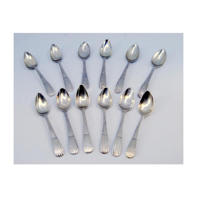 Silver Teaspoons with Fluted Handles, Set of 12, in Very Good conditions. Designed before 1890 This piece has an...