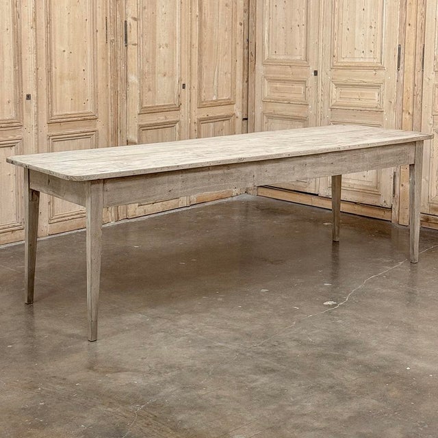 Grand 19th Century Rustic French Elm Farm Table is a lasting testament to the rural craftsman, who utilized indigenous...