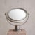 A 1960s Italian table mirror attributed to Sergio Mazza for Artemide. Cast in nickel-plated metal, the round mirror floats...