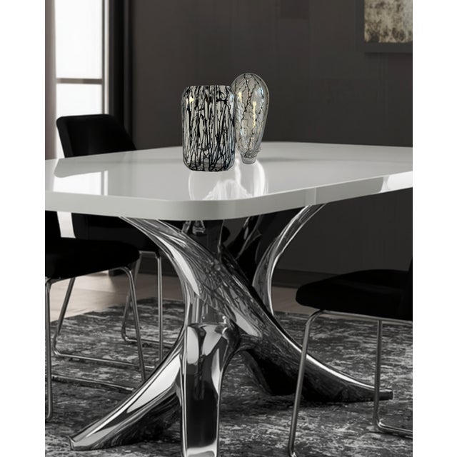 This striking pair of contemporary art‑glass vessels showcases two distinct forms that complement one another through...